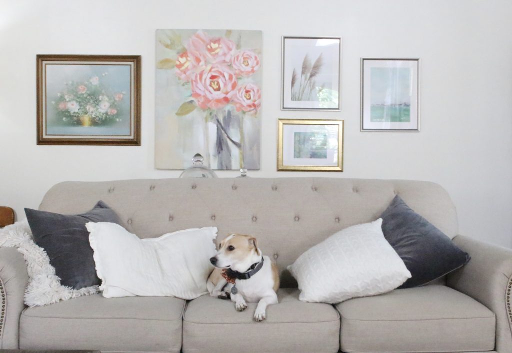 A new gallery wall in our family room- pastels- paintings- gallery wall- arrangement- wall decor- artwork- pale colors- neutrals- updated wall art